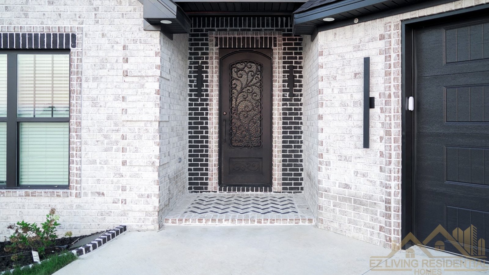 Brick entry and dark front door