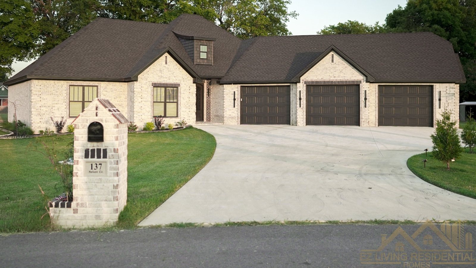 Completed Trumann brick home with three-car garage