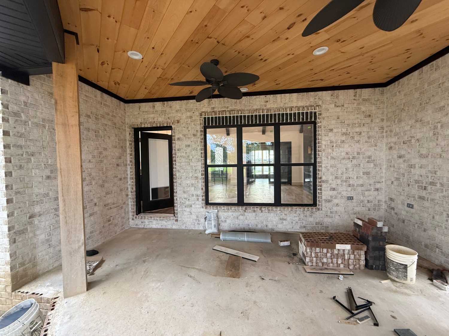 Covered back porch with tongue-and-groove wood ceiling