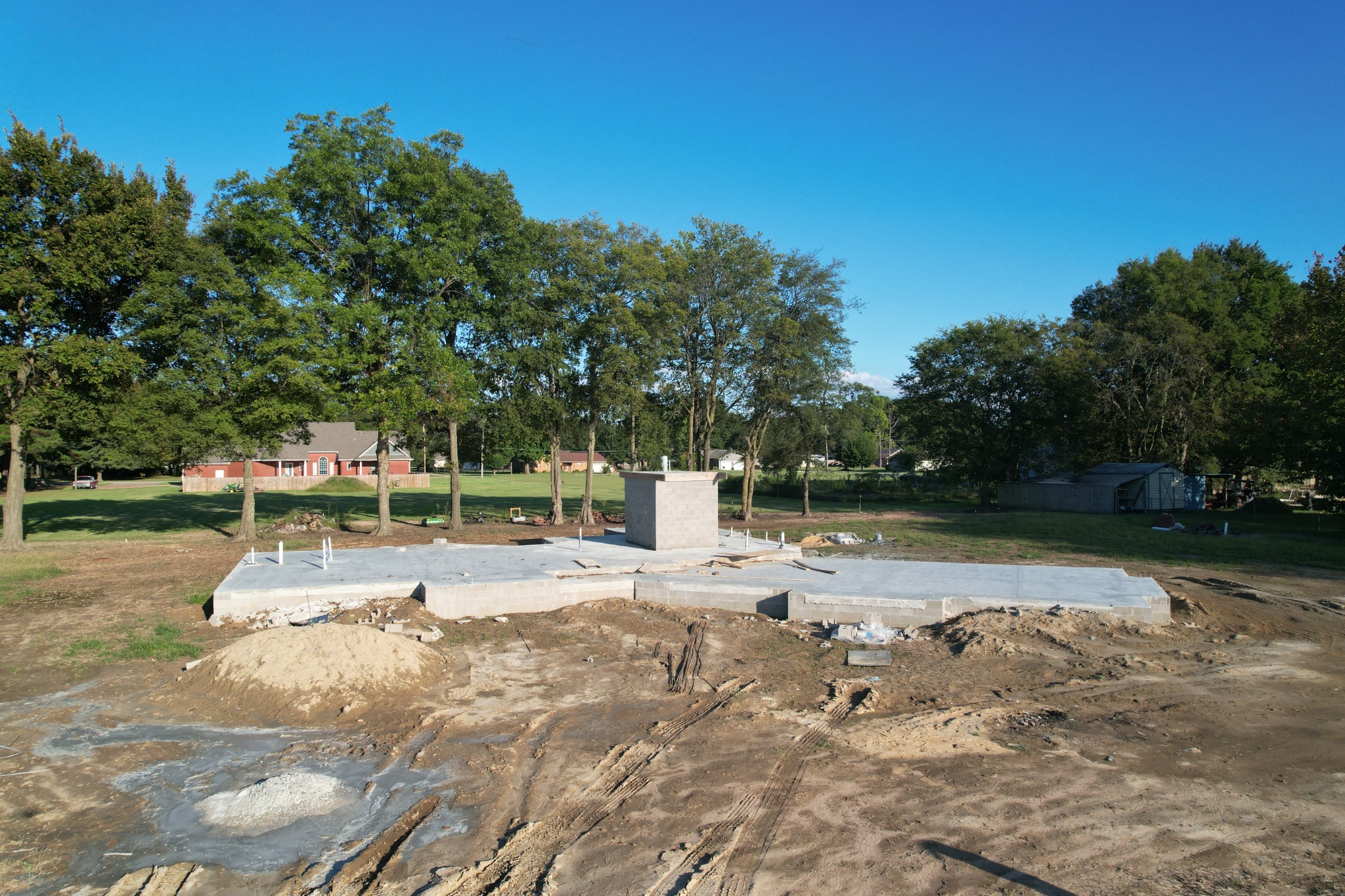 Concrete slab and block walls of the tornado safe room before home framing