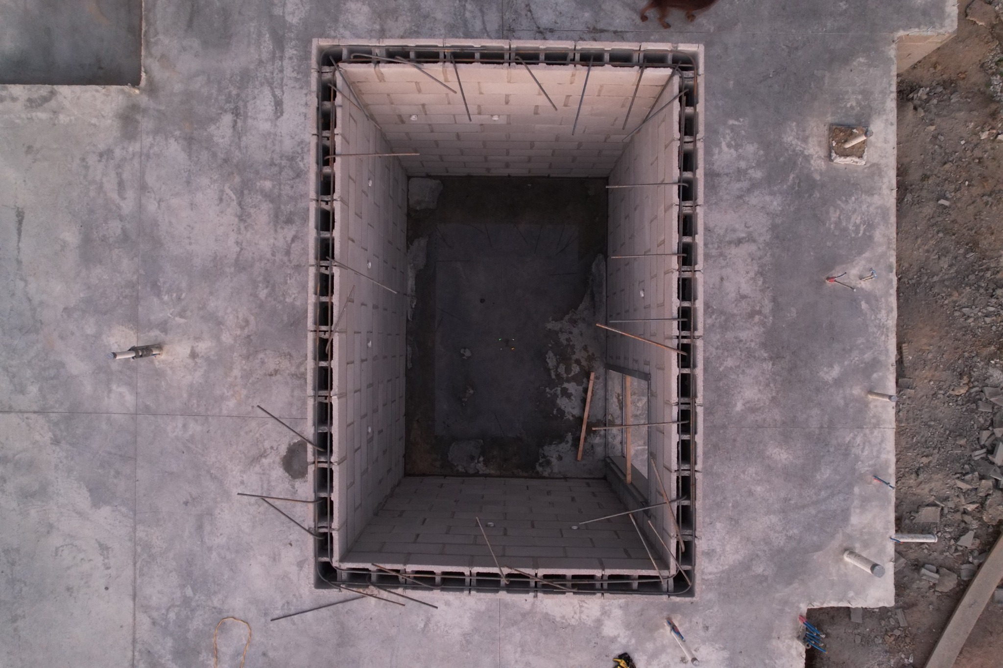 Overhead view into the tornado safe room during block construction