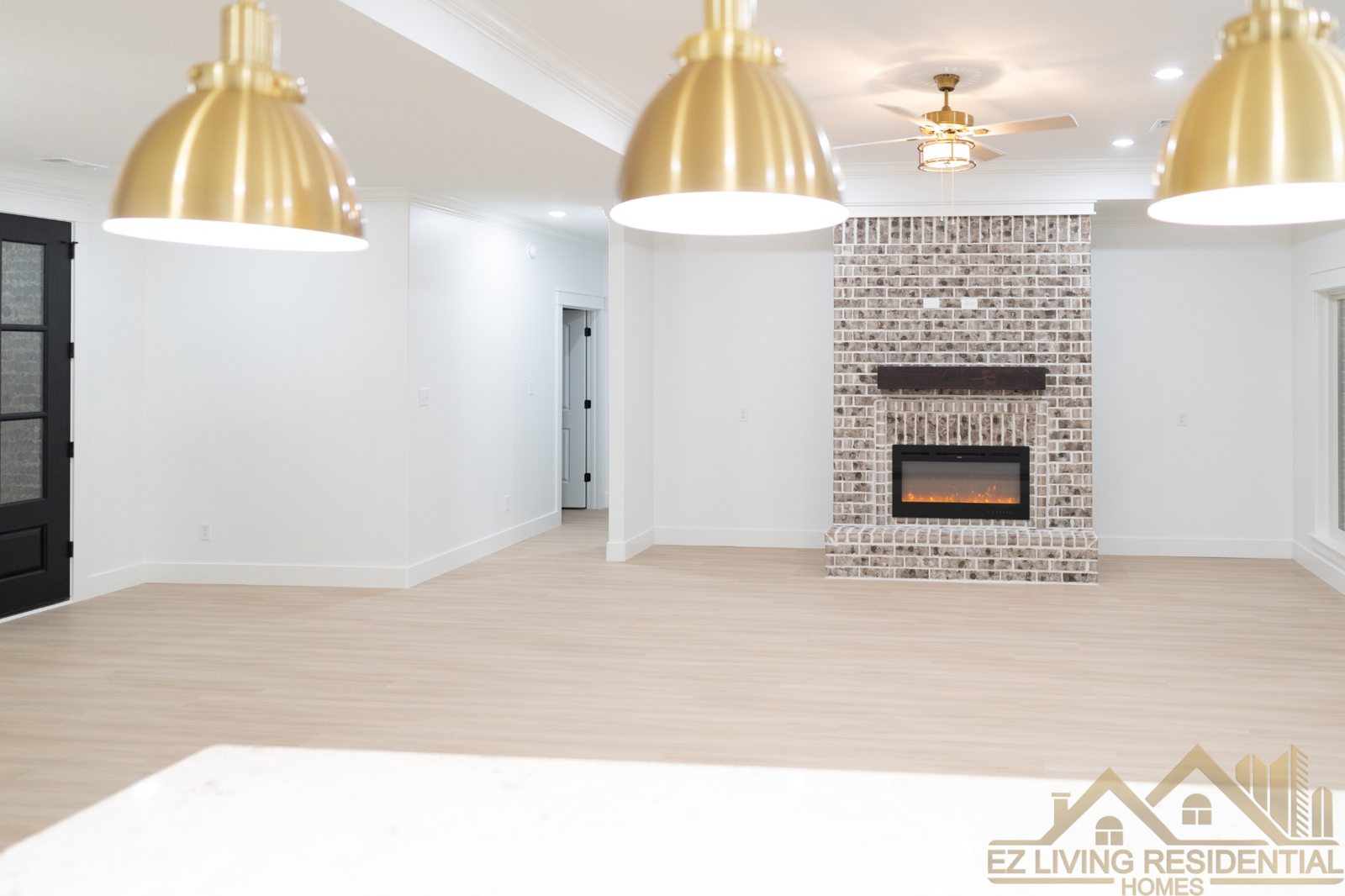 Bright living room with brick fireplace
