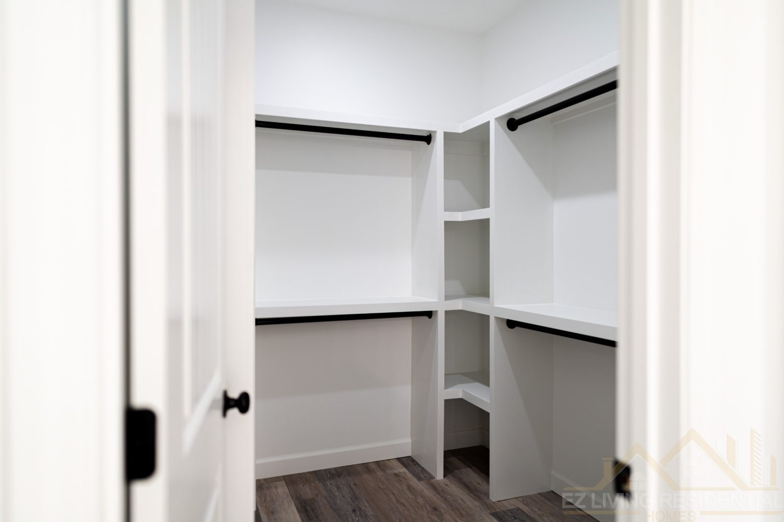 White walk-in closet with built-in shelves